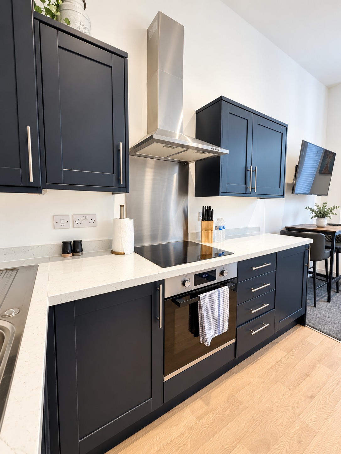 Kitchen at Luna with oven, hob and dark cabinetry